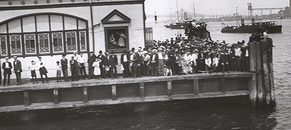  A crowd waves the ship farewell. 