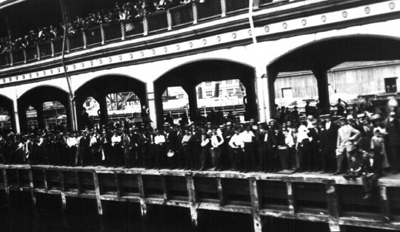 A crowd of well-wishers waves good-bye to the Roosevelt.