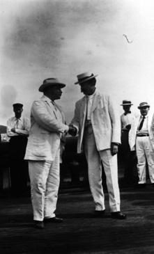 Peary shakes hands with President Roosevelt, the namesake of the arctic vessel.